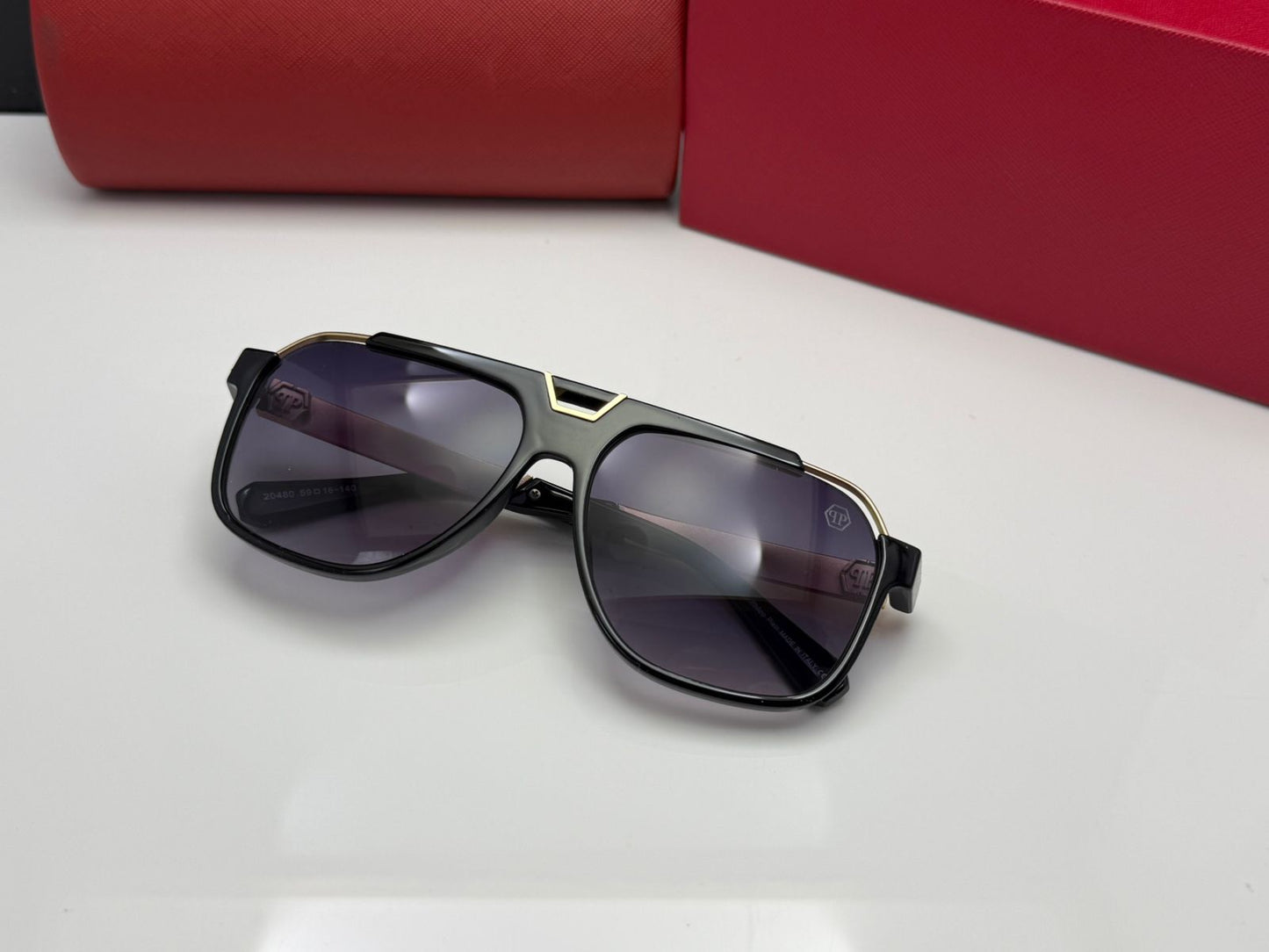 Full-Rim Square Sunglasses with a black frame and gold-tone accents.