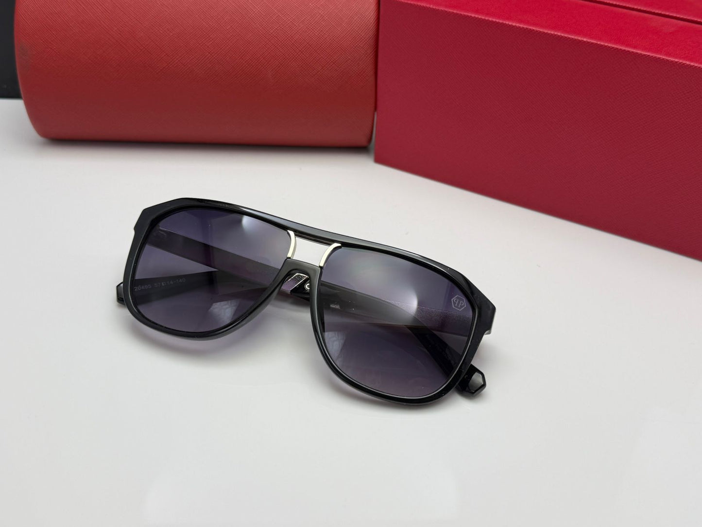 Sunglasses in Glossy Black with Geometric Frames and CR39 Gradient Lenses.
