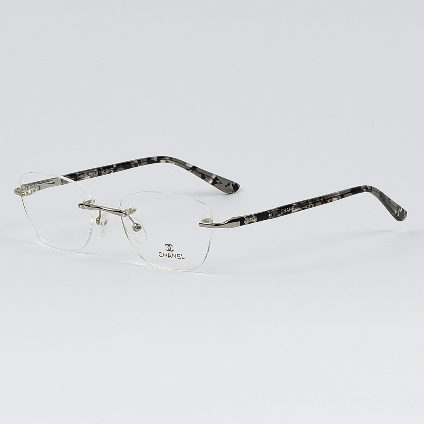 Rectangular Cat Eye Glasses with a Rim less frame and patterned Temples For Women