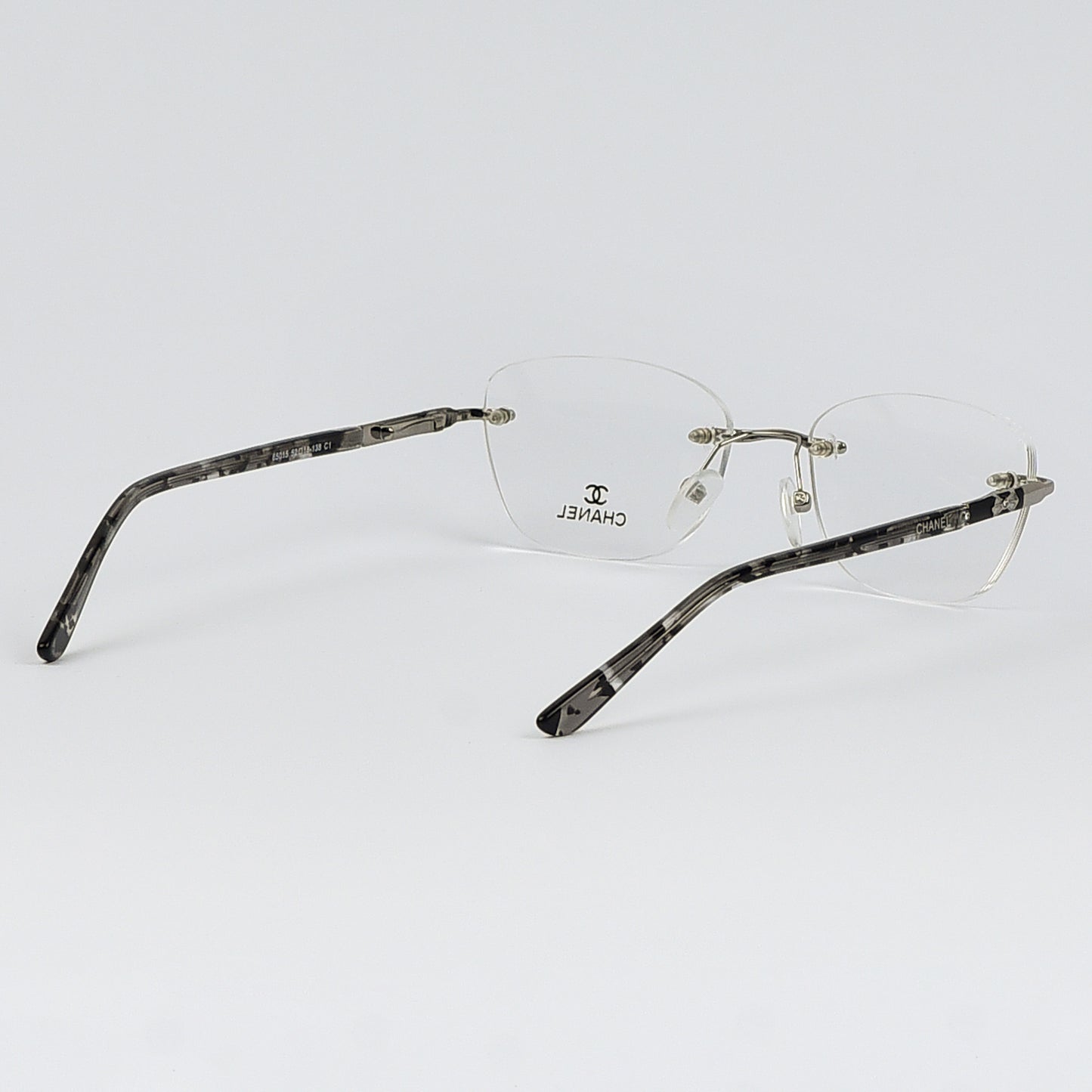 Rectangular Cat Eye Glasses with a Rim less frame and patterned Temples For Women