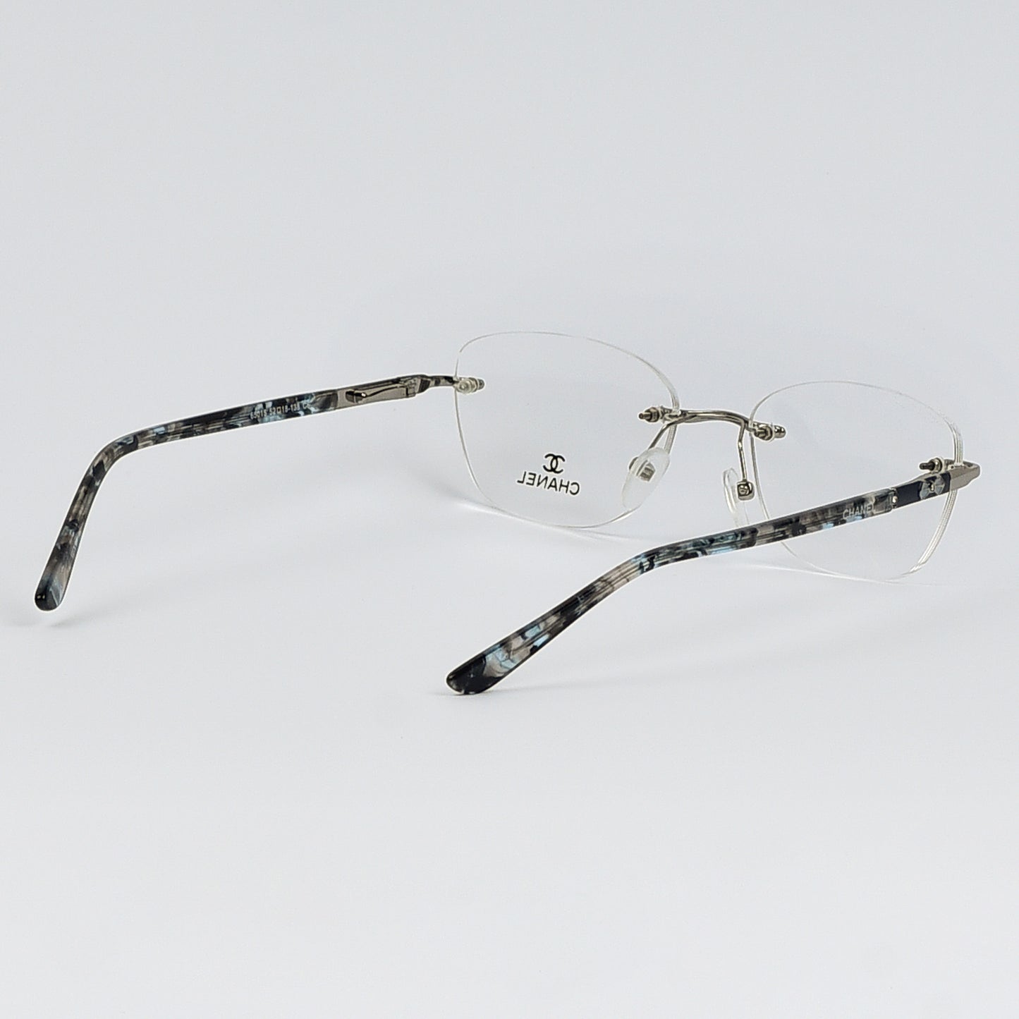 Rectangular Cat Eye Glasses with a Rim less frame and patterned Temples For Women