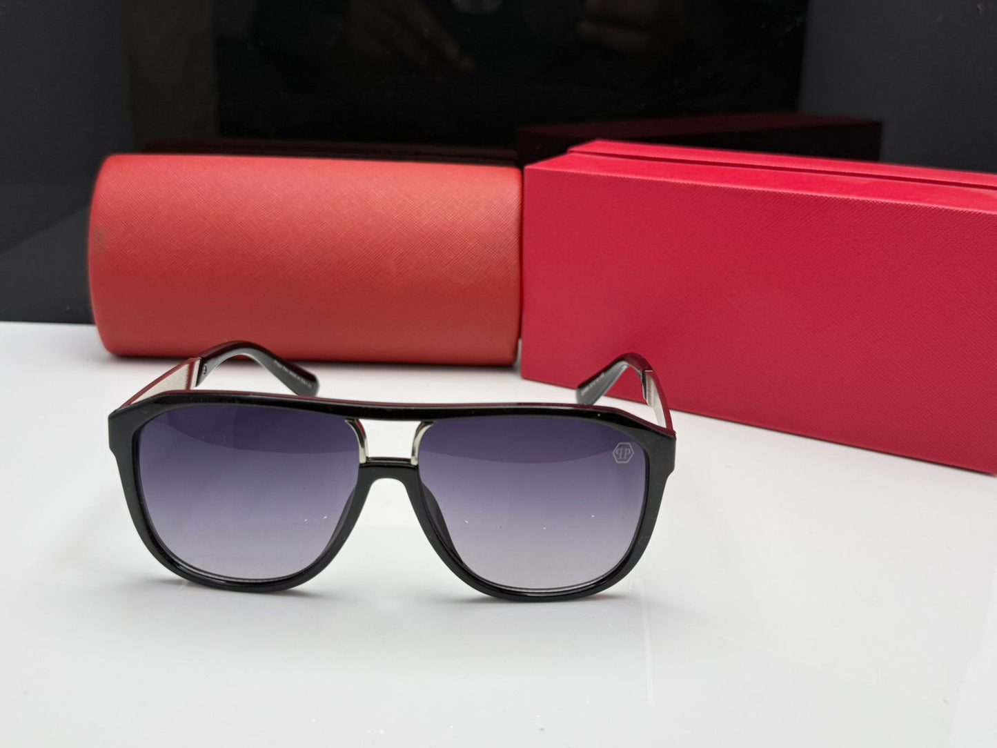 Sunglasses in Glossy Black with Geometric Frames and CR39 Gradient Lenses.