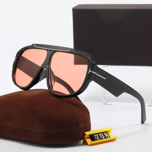 Sunglasses feature a Bold black shield Frame and Tea-Colored lenses For Men-Women