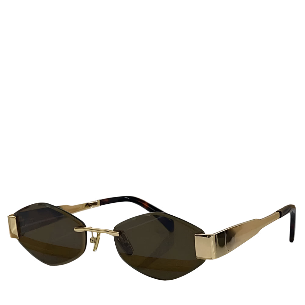 A pair of rimless sunglasses with a hexagonal design, predominantly gold in color, displayed on a reflective surface.